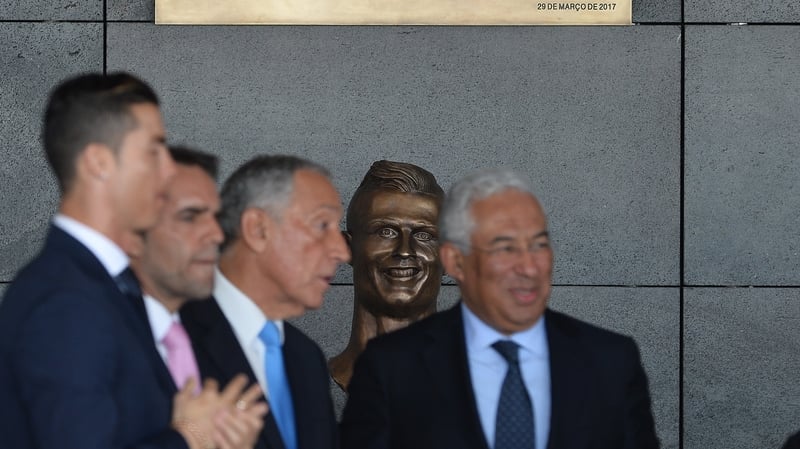 Ronaldo puts on a brave face as the statue of him is unveiled at the airport renaming