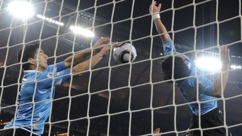 Luis Suarez (l) helped Uruguay qualify for the semi-finals of the World Cup in 2010 with this save