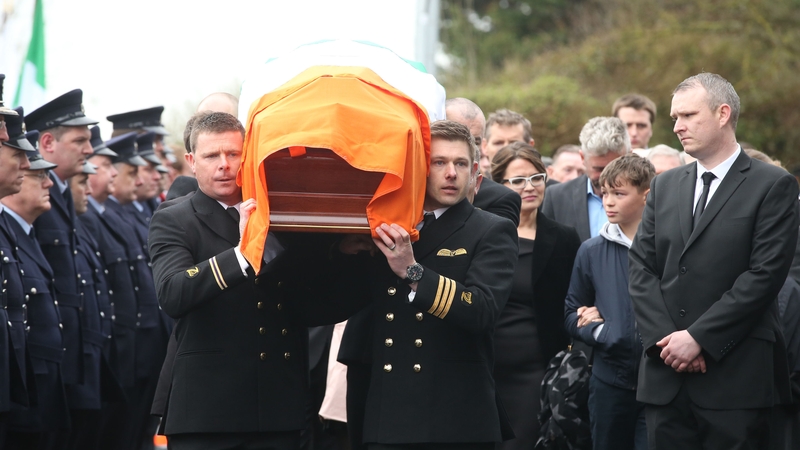 Captain Mark Duffy's remains are carried into the church
