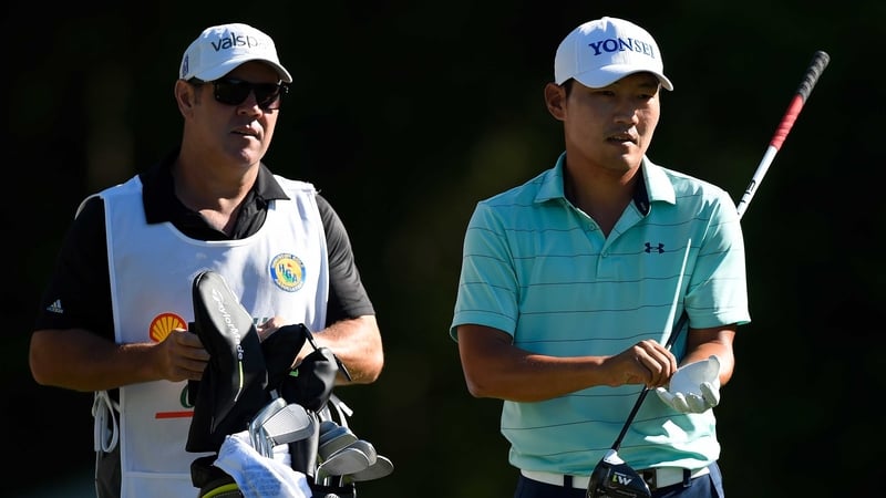 Sung Kang and his caddie on the second