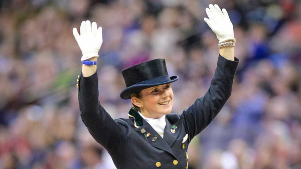Judy Reynolds waves to the crowd in Omaha