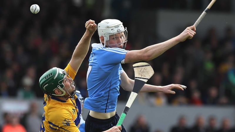 The ball evades both Cathal McInerney and Shane Barrett