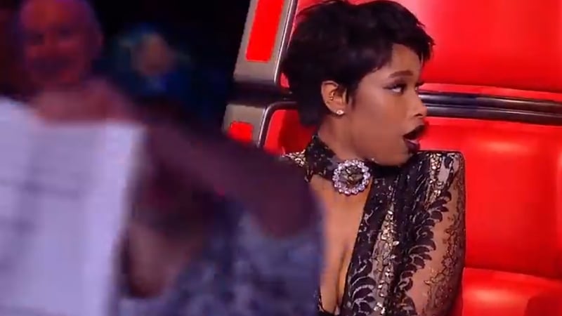 The stage intruder appears as coach Jennifer Hudson reacts to her act Mo Adeniran making the final