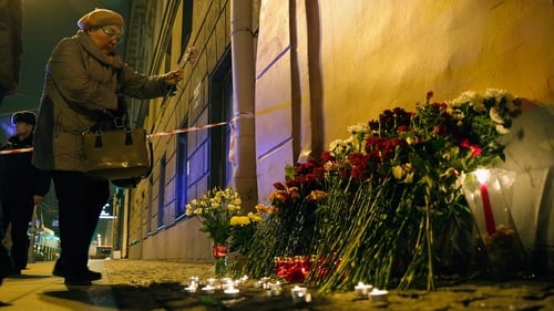 Flowers and candles were laid outside the metro station in Saint Petersburg