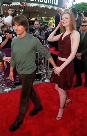 Nicole Kidman and then husband Tom Cruise attend the world premiere of 'Eyes Wide Shut' in 1999. Nicole wore a crop top and skater skirt on the red carpet. Very 90's.