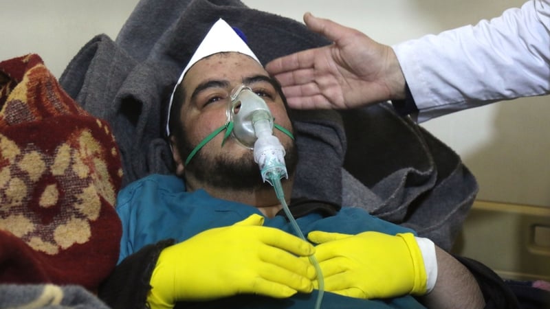 A Syrian man receives treatment following a suspected gas attack in Khan Sheikhu