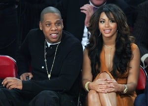 Beyoncé rocks some darker locks with Jay-Z at the NBA All-Star Game in 2007.