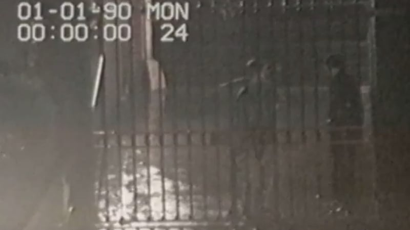 CCTV footage shows Trevor Deely (L) speaking to a man outside his workplace on the night he disappeared