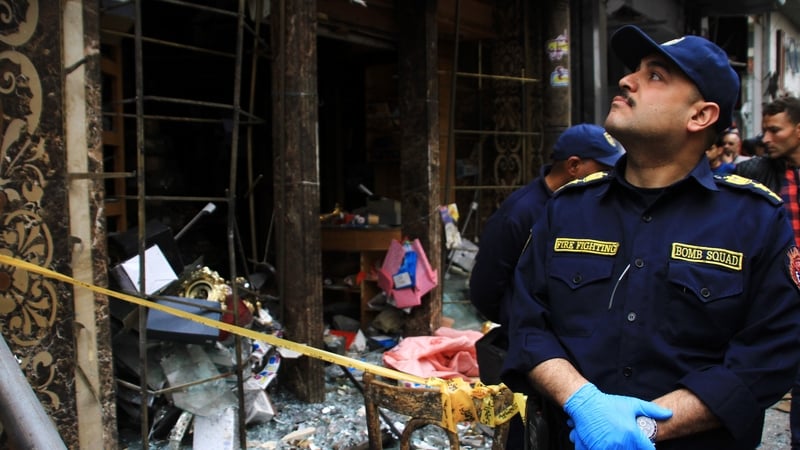 Security personnel stand guard at the scene of a bomb explosion at Saint Mark's coptic Cathedral in Alexandria