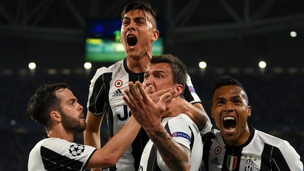 Juventus striker Paulo Dybala celebrates with Miralem Pjanic, Mario Mandzukic and Alex Sandro