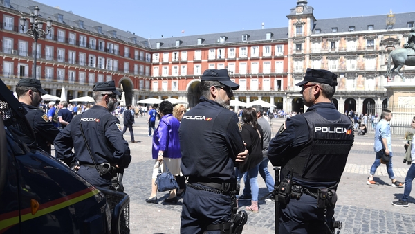Videos posted on social media show football fans gathered in a litter-strewn square and officers in riot gear