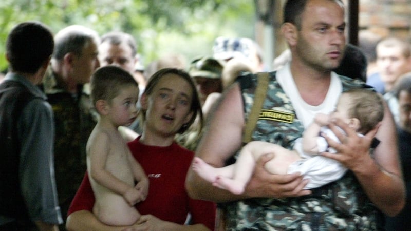 Two children seen being released from the school during the 2004 
siege