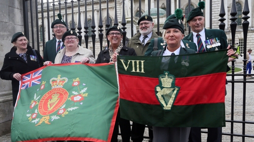 Veterans hold flags outside Belfast City Hall