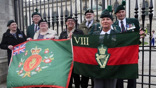 Veterans hold flags outside Belfast City Hall