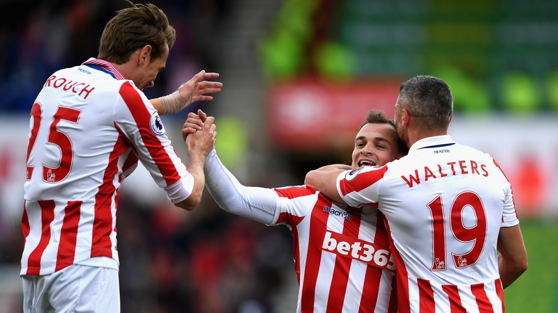 Xherdan Shaqiri is congratulated by Peter Crouch and Jonathan Walters