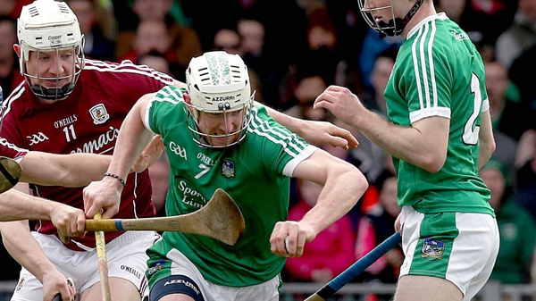 Limerick's Seamus Hickey evades Joe Canning