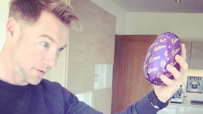 Ronan Keating bashes open his Easter egg with his head, image via Instagram