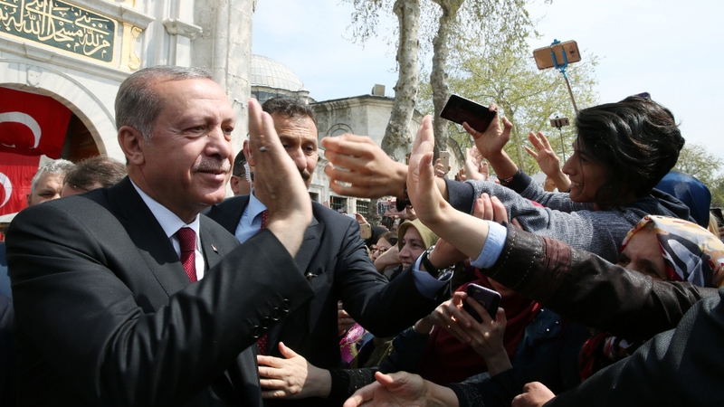 Recep Tayyip Erdogan greets people today after praying at Eyup Sultan mosque in Istanbul
