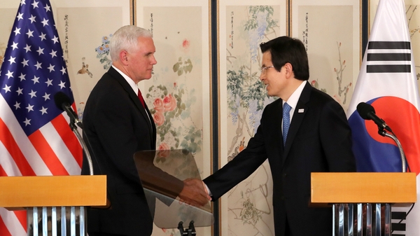 South Korea's Acting President Hwang Kyo-ahn (R) and Mike Pence hold a joint news conference on the allies' robust alliance against North Korea's military provocations in Seoul, South Korea
