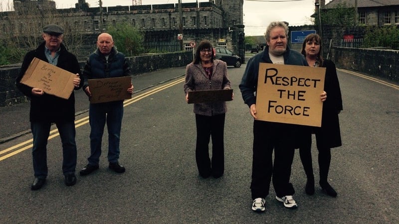Spouses and former Defence Force workers protest on behalf of current members at Renmore Barracks in Galway
