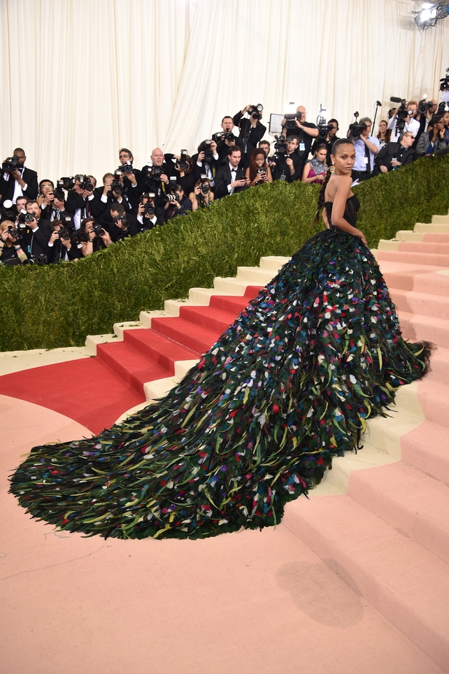 Now this is impressive. This dreamy Dolce & Gabbana feathered gown has one of the longest trains we've ever seen, but Zoe wears it like a queen. She killed it at the 'Manus x Machina: Fashion In An Age Of Technology' Costume Institute Gala in 2016.