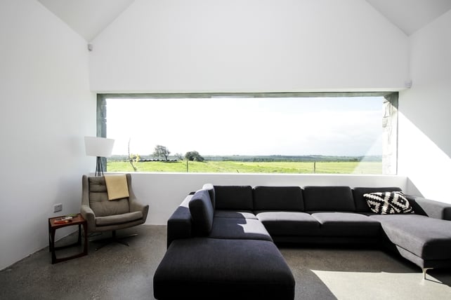 High ceiling and enormous picture windows made this farmhouse a winner.