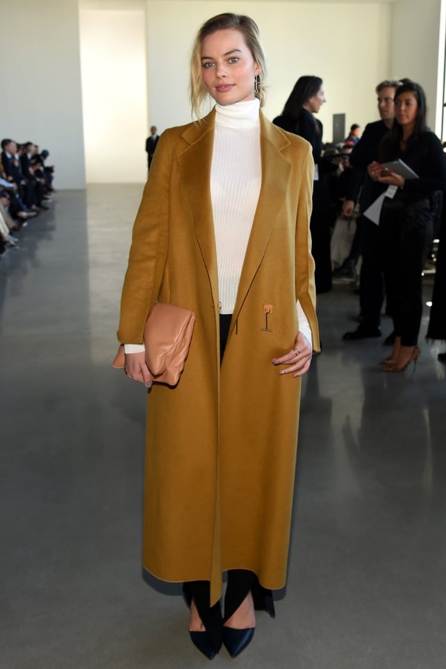 Wearing Calvin Klein for the the Calvin Klein New York Fashion Week show in 2016. She's rocking a polo neck and coat like no one else!