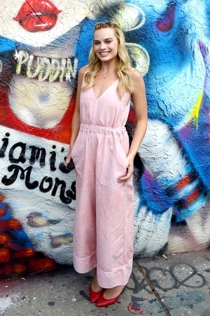 We adore this wide leg jumpsuit and red babouche heels - a really cool combo! Margot was attending the 'Suicide Squad' Wynwood Block Party and Mural Reveal in 2016.