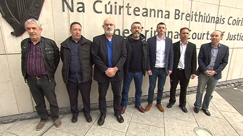 Seven men deny falsely imprisoning Joan Burton and her assistant
