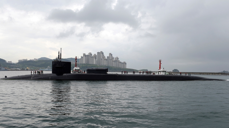 A handout photo made available by the United States Department of Defense shows the Ohio-class guided-missile submarine USS Michigan arriving in Busan, South Korea
