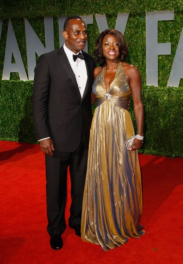 Viola Davis shines alongside her husband Julius Tennon at the Oscars ceremony in 2009 in a Reem Acra halter neck. The actress was nominated this year for her role in the movie 'Doubt'.