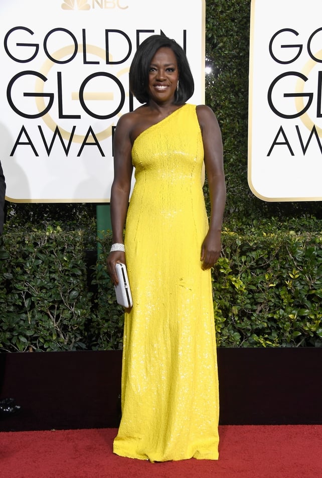 The actress is magnificent in this bright yellow Michael Kors dress at the 2017 Golden Globes ceremony when she won the award for the Best Performance by an Actress in a Supporting Role in a Motion Picture for 'Fences'.