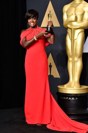 The ultimate recognition! Viola Davis exudes happiness winning her first Best Supporting Actress this year. She was wearing an Armani gown for the occasion, Stunning as usual.