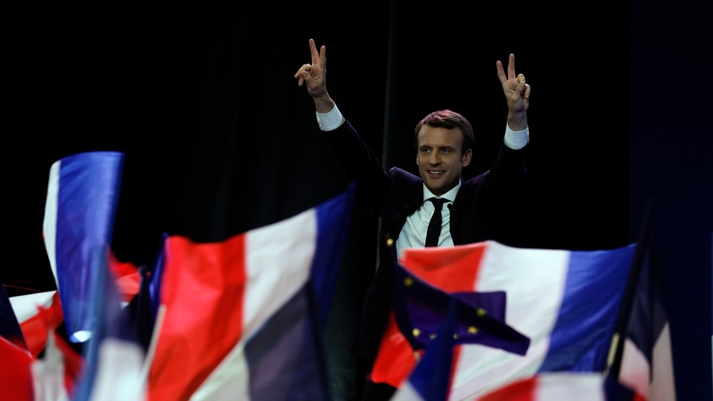Emmanuel Macron gave a 15-minute speech on Sunday night and held his arms aloft in a V for victory