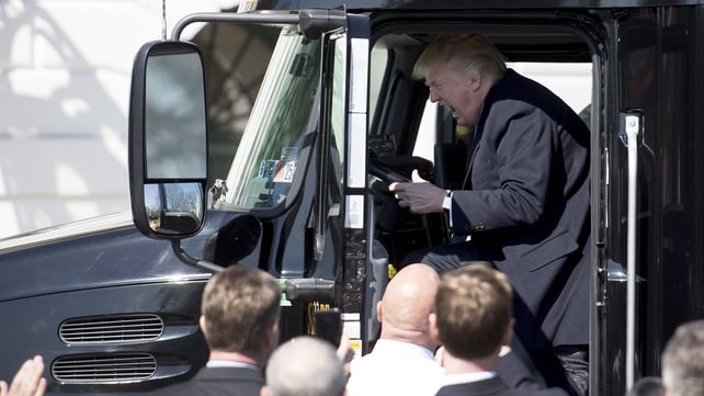 Donald Trump sits in the driver's seat of a truck in 2017 as he welcomes truckers and CEOs to the White House to discuss healthcare