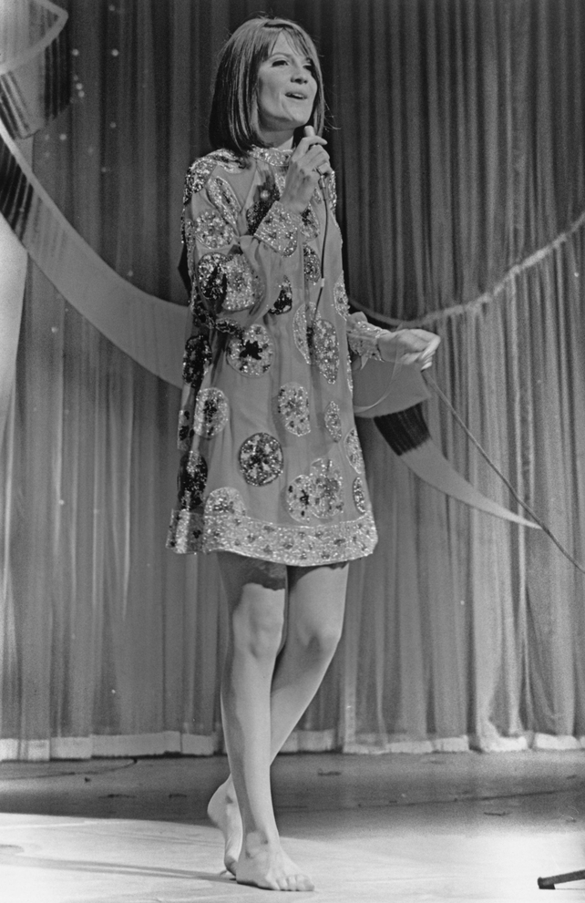 Singer Sandie Shaw embodying the sixties spirit in an embroidered mini dress and...bare feet! This year in 1967, her song 'Puppet On A String' was the first British song to win the contest!