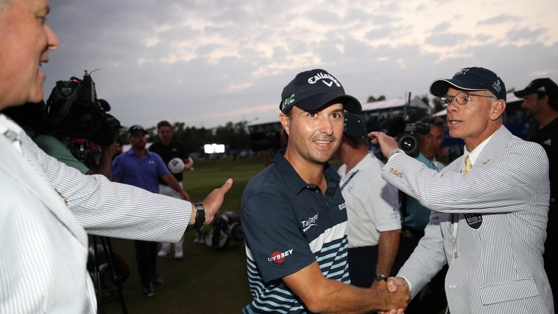 Kevin Kisner leaves the course after making his eagle