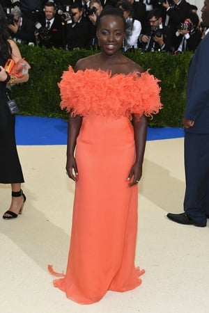 Radiant, Lupita Nyong'o wore a feathers Prada gown.