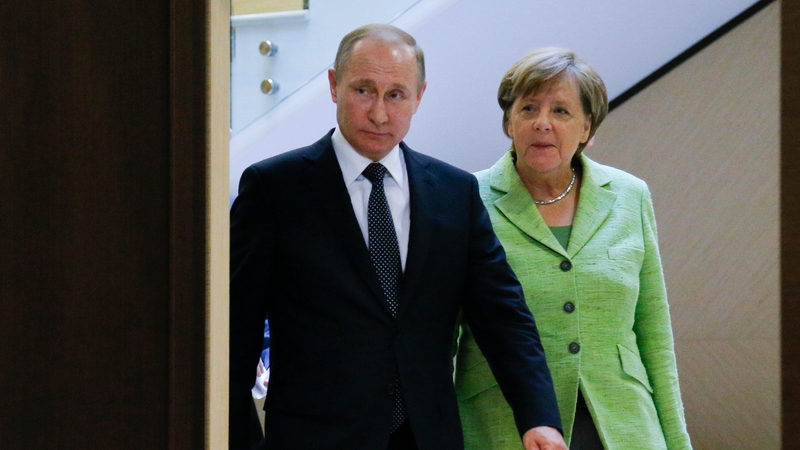 Vladimir Putin was speaking at a joint news conference with German Chancellor Angela Merkel
