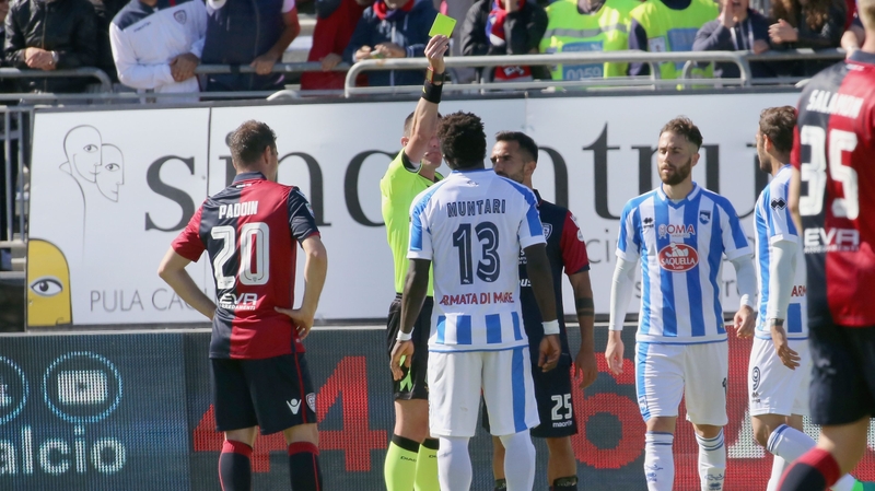 Muntari is shown a yellow card by Daniele Minelli in Italy at the weekend