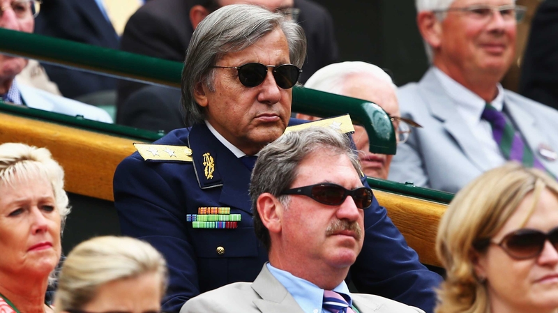Ilie Nastase, in the navy blazer, watches on from the Royal Box at Wimbledon back in 2014