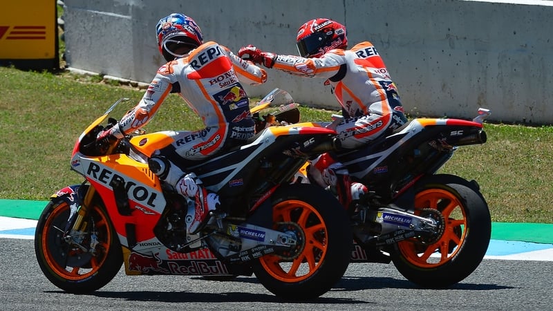 Dani Pedrosa (near) celebrates with teammate Marc Marquez