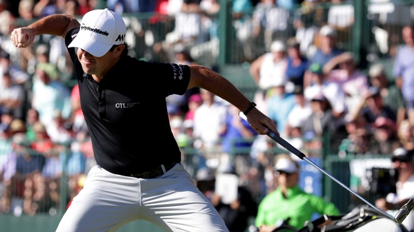 Brian Harman celebrates his title-clinching putt