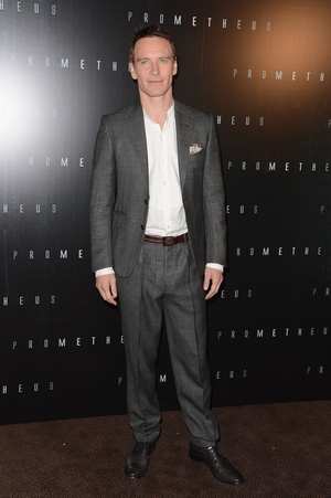 Fresh faced and looking smart at the 'Prometheus' Paris photocall in 2012. It's all in the detail with this classy pocket handkerchief and checked suit.