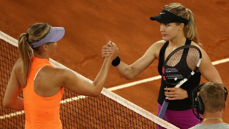 Eugenie Bouchard makes eye contact with Maria Sharapova as they shake hands after the match