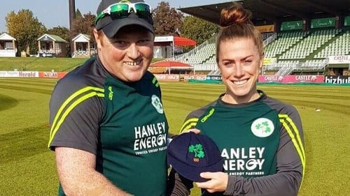 Mary Waldron is presented with her 100th cap by Andrew Poynter