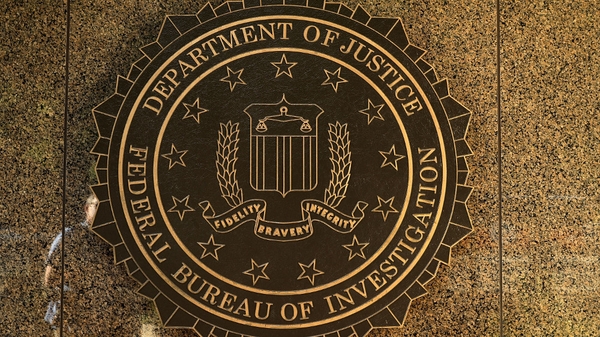 The agent was taken to police headquarters and then released to an FBI supervisor