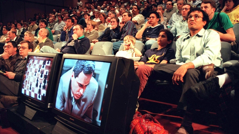 Chess fans watch progress of the first game between World Chess Champion Garry Kasparov and the IBM Deep Blue computer