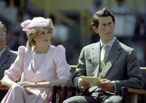 Diana and Charles watch an official event during their first royal Australian tour in 1983.