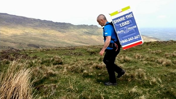 Man 'shares the load' in mental health awareness climb